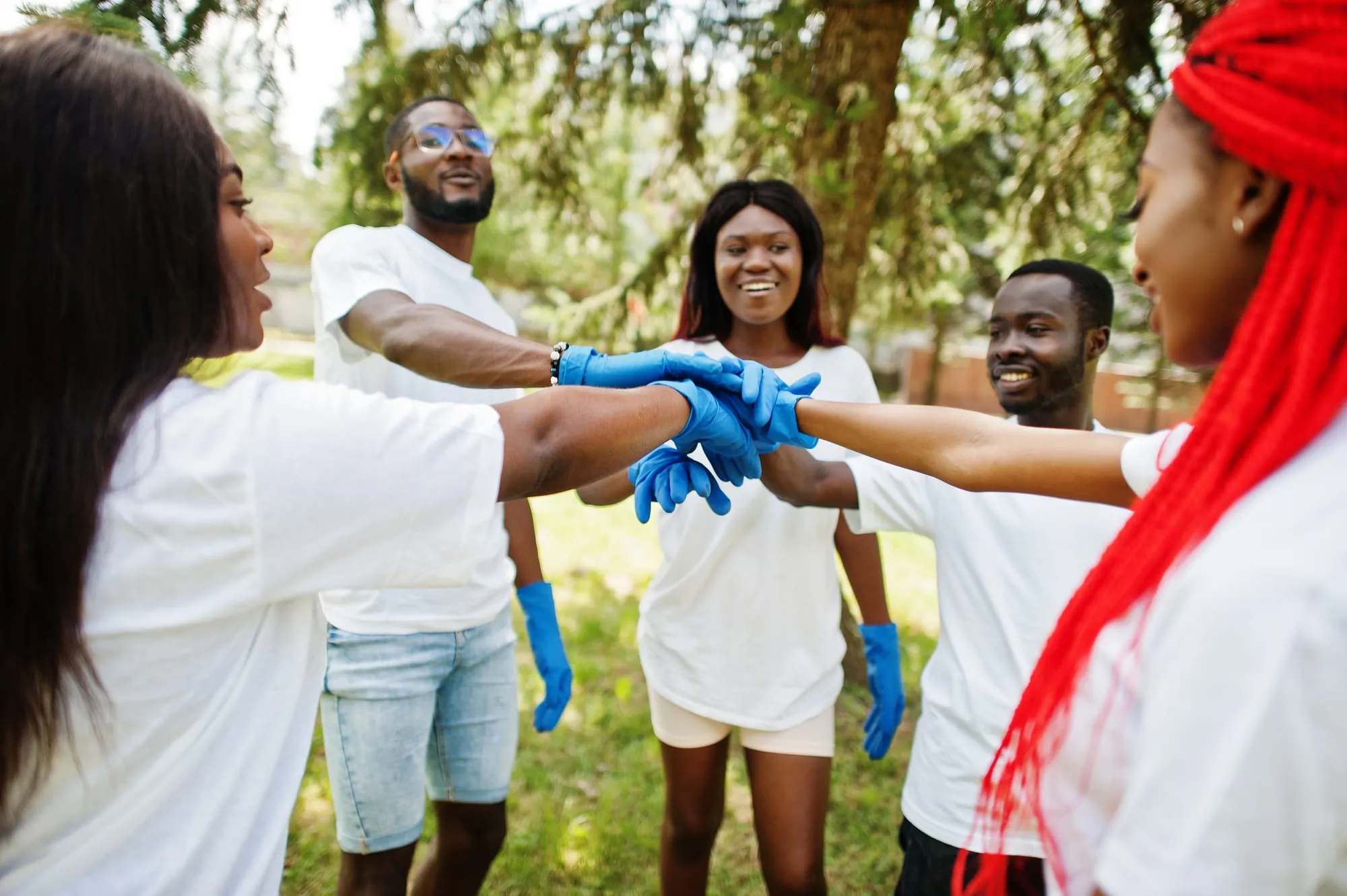 Young Barbadians talking together outside school